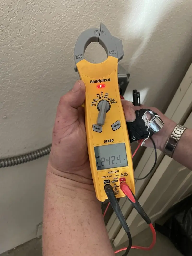 Voltage testing with clamp meter during Aluminum Wiring Replacement in Willis